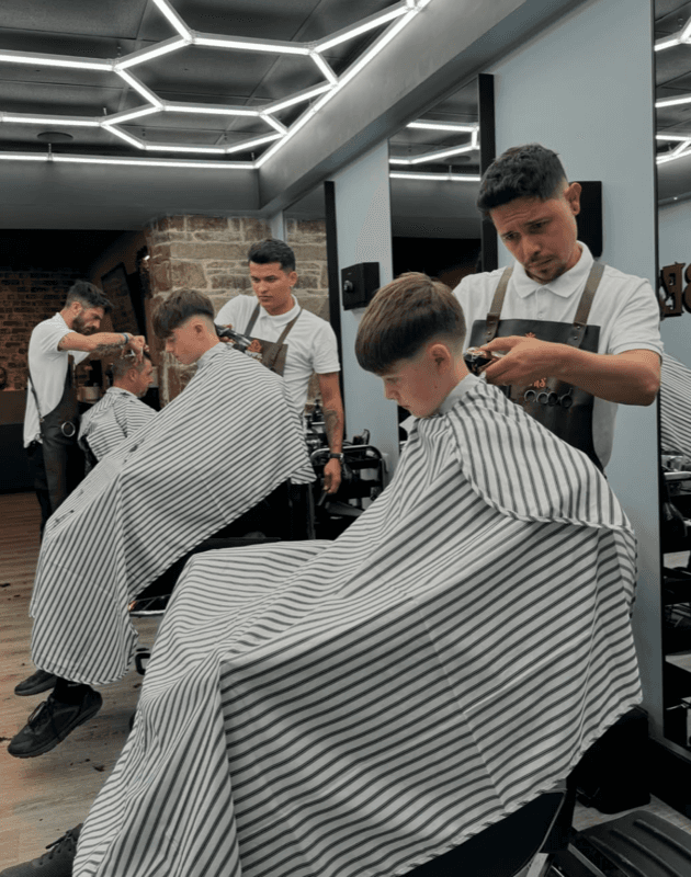 Barbershop interior — full row of chairs